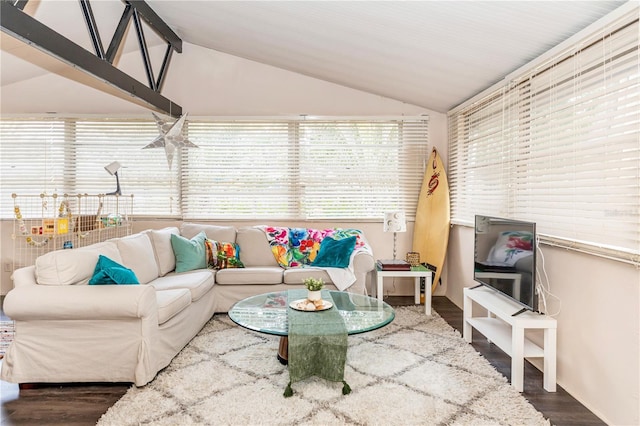 living room featuring hardwood / wood-style flooring and lofted ceiling with beams