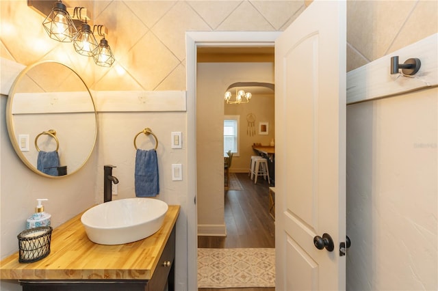 bathroom with hardwood / wood-style flooring and vanity