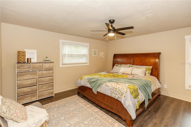 bedroom featuring ceiling fan and dark hardwood / wood-style flooring