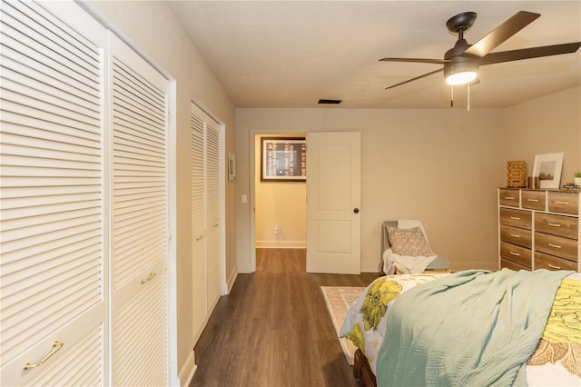 bedroom with ceiling fan and dark hardwood / wood-style flooring