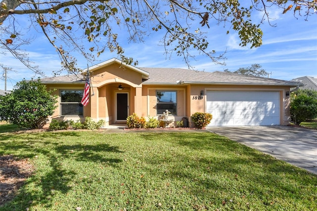 ranch-style home featuring a garage and a front lawn