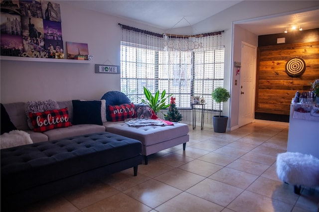 tiled living room featuring lofted ceiling