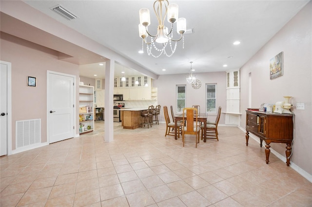 tiled dining area with a notable chandelier