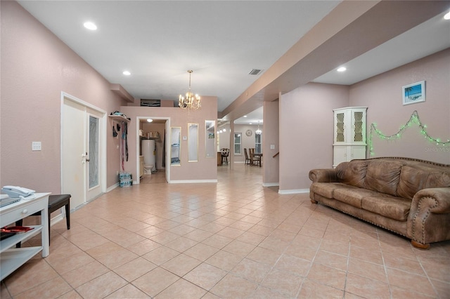 tiled living room featuring french doors and a notable chandelier