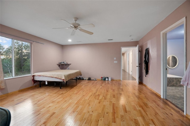 bedroom with light hardwood / wood-style flooring and ceiling fan