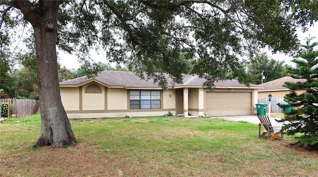 single story home featuring a garage and a front yard