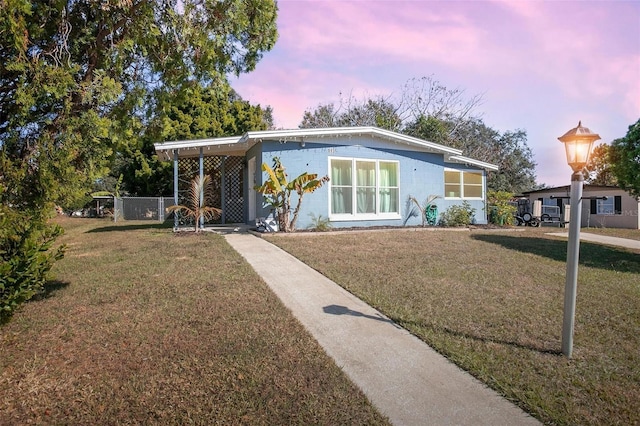 view of front of home featuring a lawn