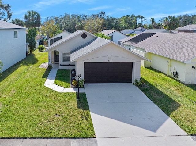 view of front facade with a front lawn and a garage