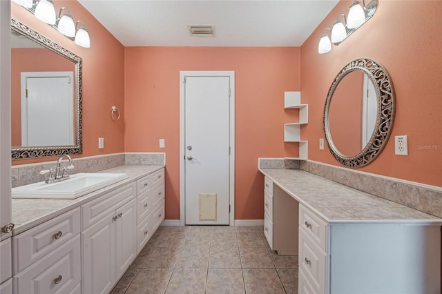 bathroom featuring tile patterned floors and vanity