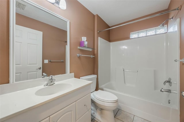 bathroom featuring tile patterned floors, vanity, and toilet