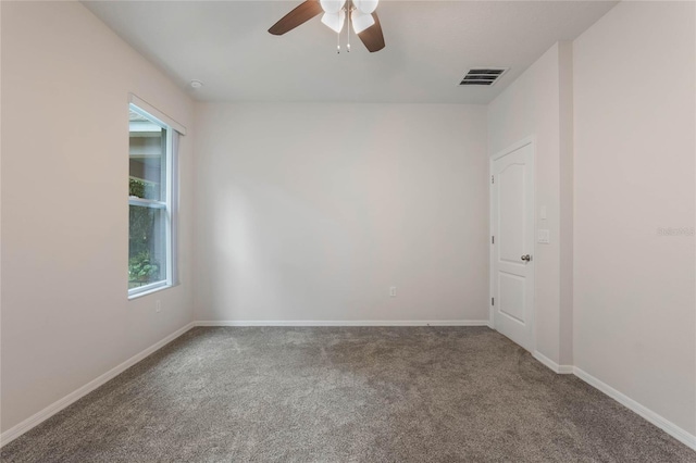 carpeted empty room with ceiling fan