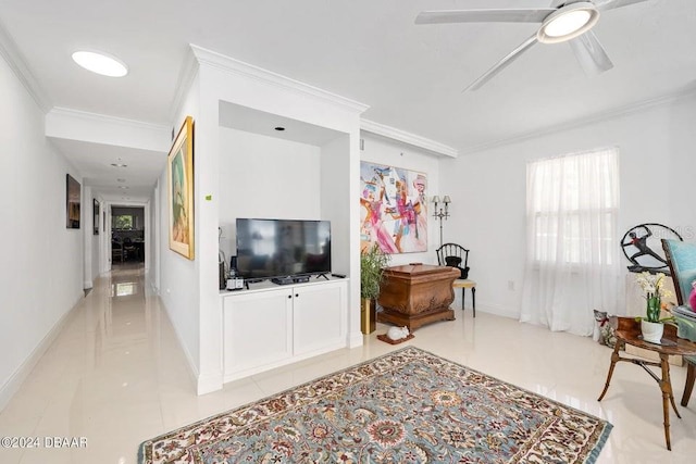 tiled living room with ceiling fan and ornamental molding