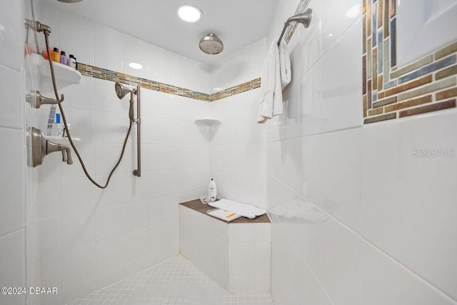 bathroom with a tile shower