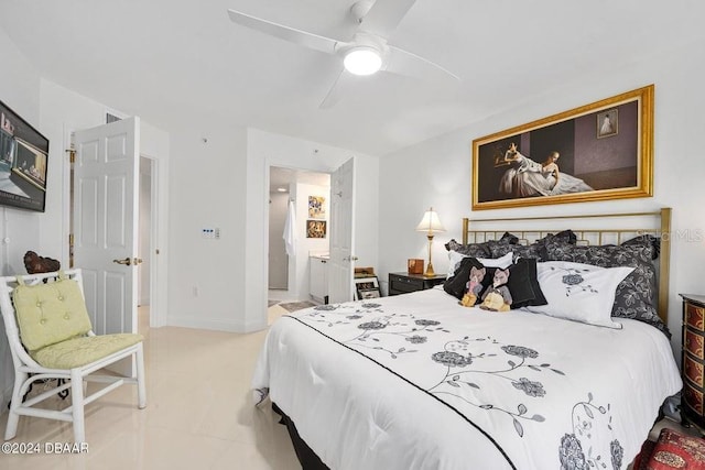 bedroom featuring ceiling fan and ensuite bath