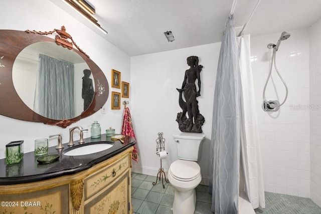 bathroom with a shower with curtain, tile patterned flooring, vanity, and toilet