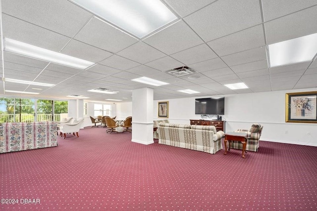 interior space with carpet and a drop ceiling