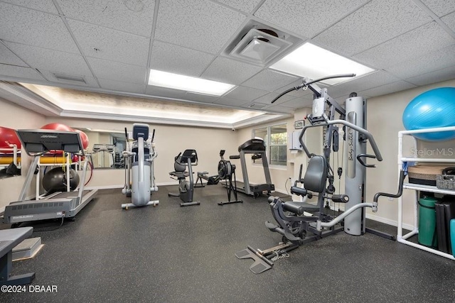 gym featuring a paneled ceiling