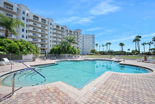 view of swimming pool featuring a patio area