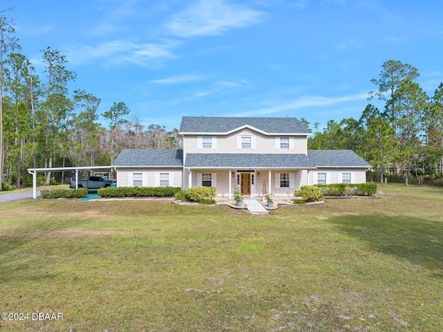 view of front facade with a porch, a carport, and a front lawn