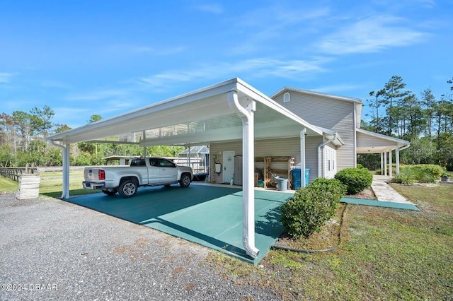 view of vehicle parking featuring a carport