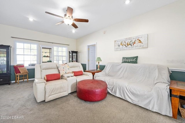 living room with carpet floors and ceiling fan