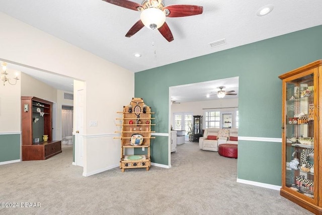 recreation room with carpet flooring and ceiling fan