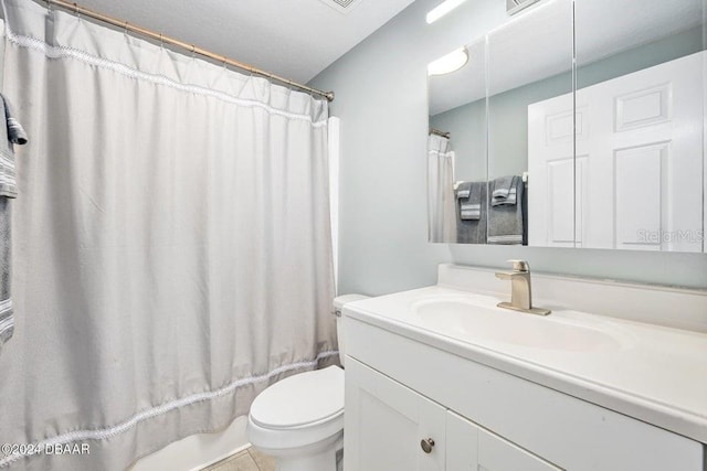 full bathroom featuring vanity, shower / bath combo with shower curtain, and toilet