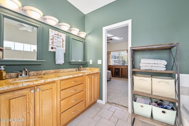 bathroom featuring tile patterned flooring and vanity