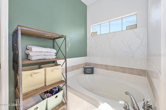 bathroom featuring a relaxing tiled tub