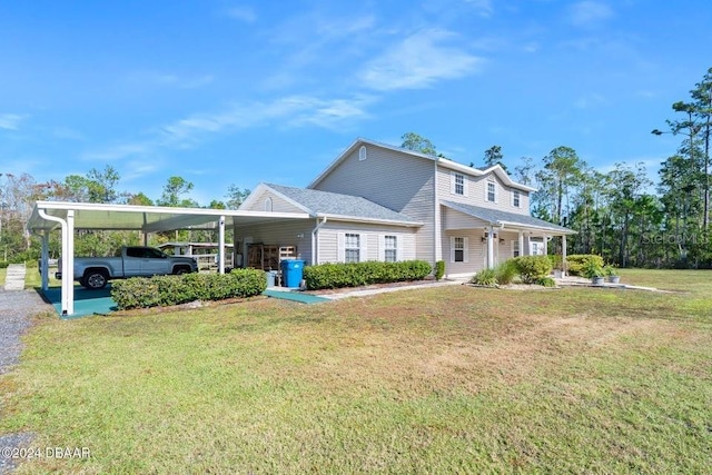 view of front facade with a carport and a front lawn