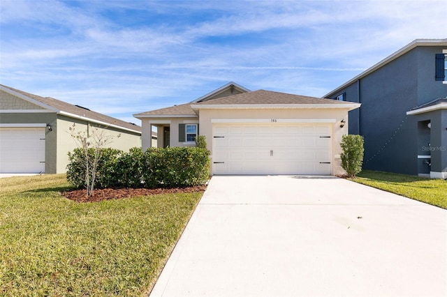 view of front facade with a garage and a front yard