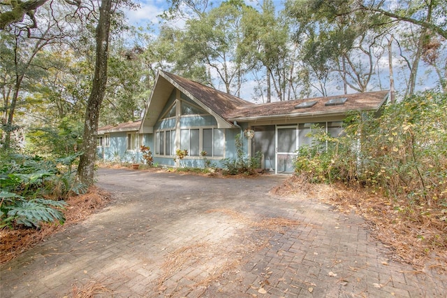 view of front of home featuring a sunroom