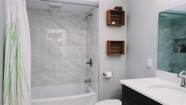 full bathroom with vanity, shower / bath combination with curtain, and toilet