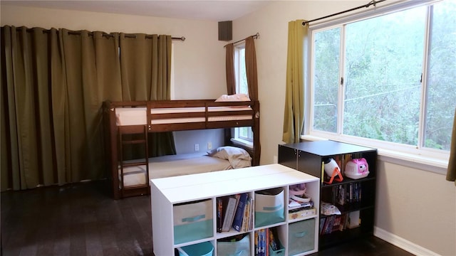 bedroom featuring dark wood-type flooring