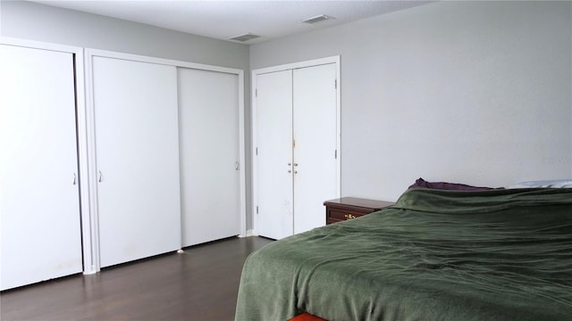 bedroom featuring two closets