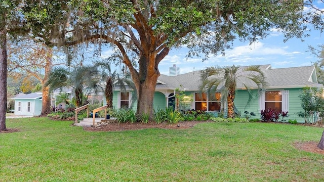 ranch-style home with a front lawn