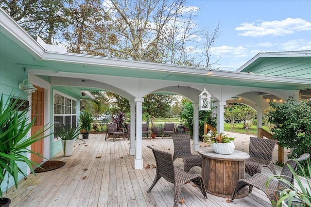 wooden deck featuring outdoor lounge area