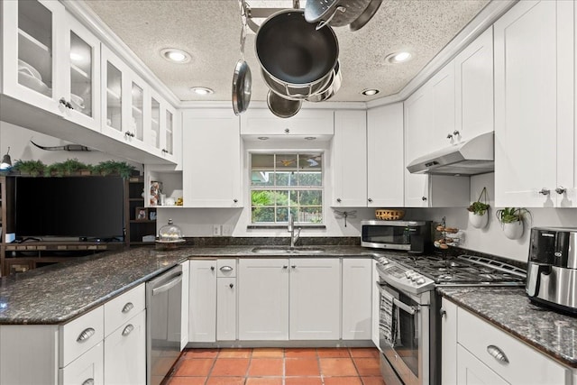 kitchen featuring white cabinetry, sink, and appliances with stainless steel finishes