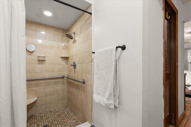 bathroom featuring curtained shower and tile patterned flooring