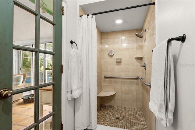 bathroom with tile patterned flooring and a shower with curtain