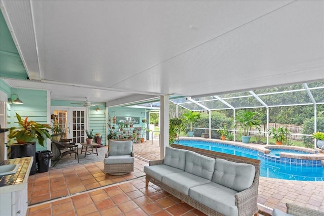 sunroom featuring a pool and plenty of natural light