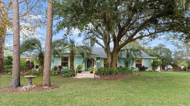 ranch-style home with a front lawn