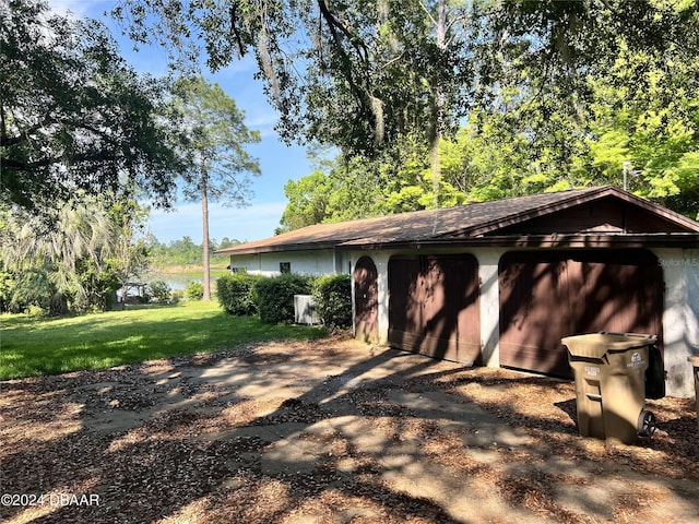 garage featuring a yard