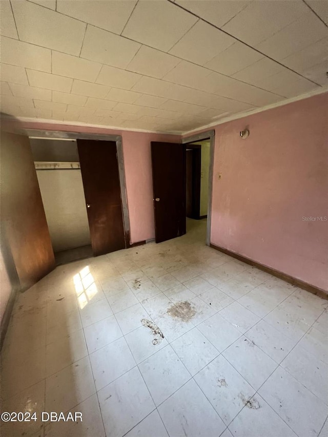 unfurnished bedroom featuring a closet