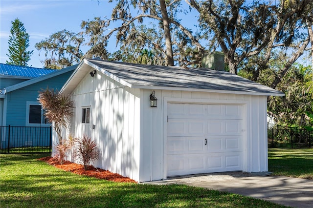 garage with a lawn