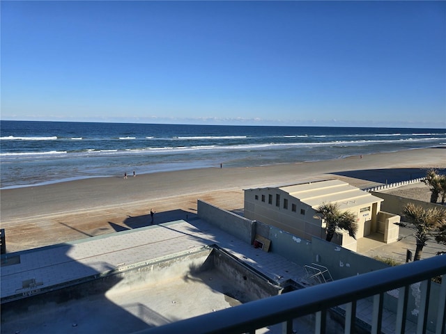 bird's eye view featuring a water view and a beach view