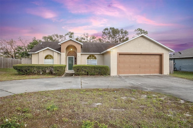 single story home featuring a garage