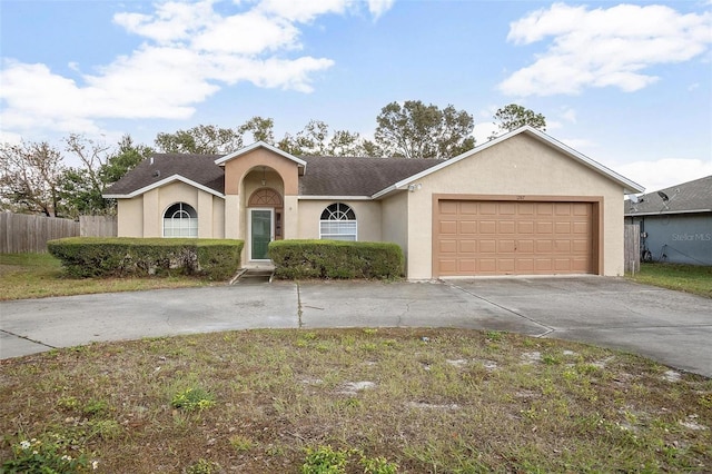 ranch-style home featuring a garage