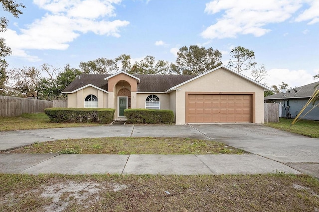 single story home featuring a garage