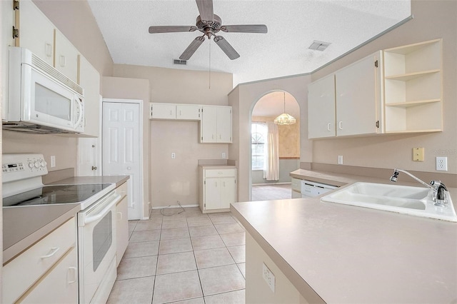 kitchen featuring ceiling fan, sink, pendant lighting, a textured ceiling, and white appliances